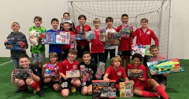 2011 Boys gifting toys to families less fortunate for Christmas