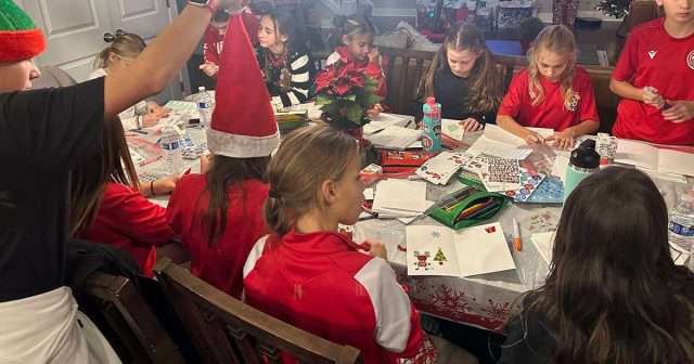 2014 Ladies Team Red spread holiday cheer